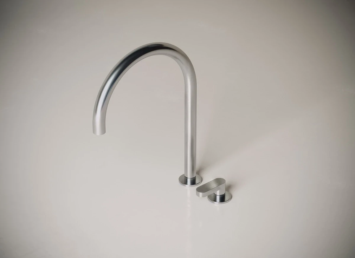 Stainless steel kitchen faucet, modern design and durability, ideal for contemporary kitchens.